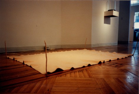 tarp stretched over gallery floor