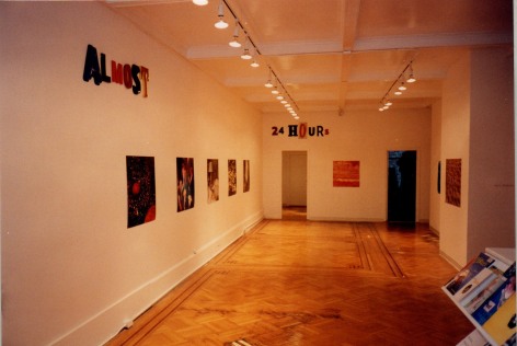 Install view, showing printed photos and lettering
