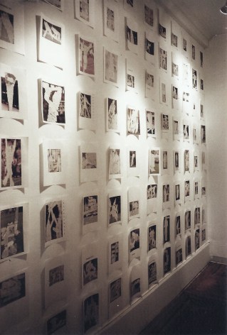Wall of black and white photo prints