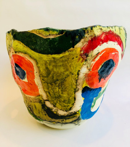 Close up of multicolored Roger Herman ceramic vase