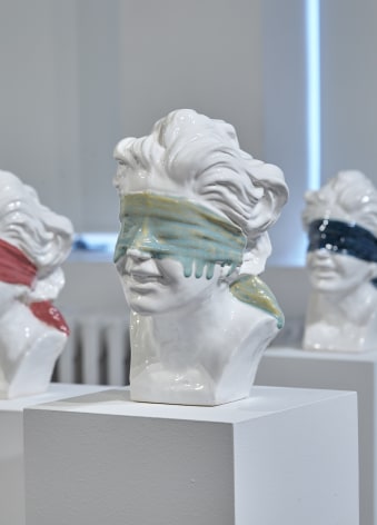 Ceramic bust of blindfolded face