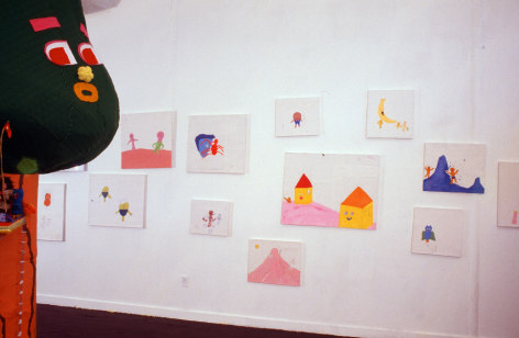 Painted works, installation view, next to cloth made tree