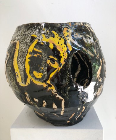Closeup view of untitled yellow and black ceramic