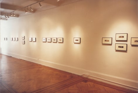 Installation view of several framed Opie photographs
