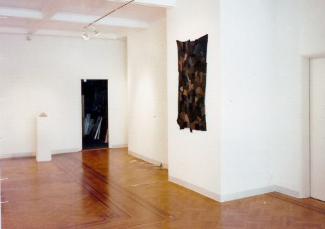 Installation view, showing textile on wall