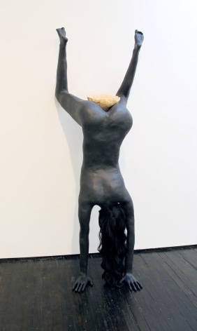woman doing handstand sculpture