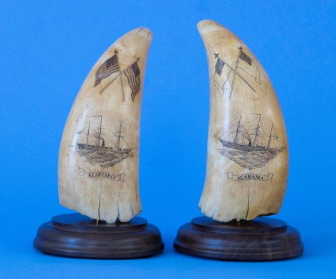 Pair of Scrimshaw Teeth One identified as the &quot;Alabama&quot; and the other the &quot;Kearsarge&quot; each with a pair of Crossed Polychrome Flags below the tip. American circa 1864.