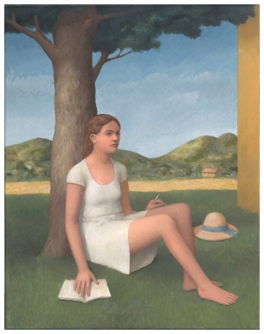 Young woman sitting in front of tree on grass with rolling hills behind her