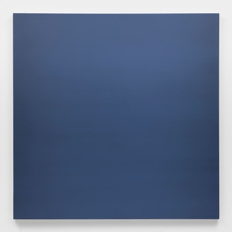 Dark gray-blue square painting hanging on white wall