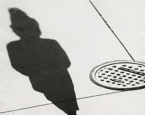 Marvin Newman - Woman with Manhole Cover, Shadow Series, Chicago, 1951 - Howard Greenberg Gallery - 2019