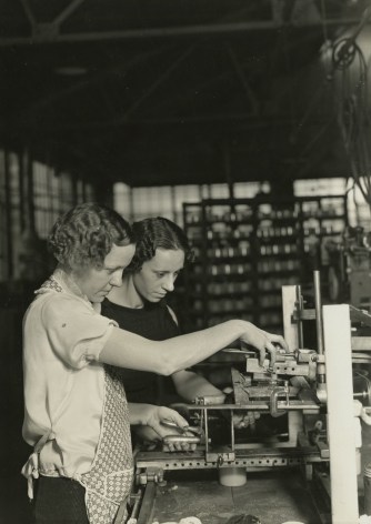 Lewis Hine - Two girls stamping glass jars in the art room at T. C. Wheaton Company. Millville, New Jersey, 1936-37 Gelatin silver print; printed c.1936-37 6 5/8 x 4 5/8 in.