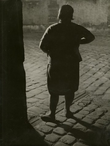 Streetwalker near the Place d'Italie (from behind), c.1932  Gelatin silver print; printed 1954  11 1/2 x 8 5/8 inches