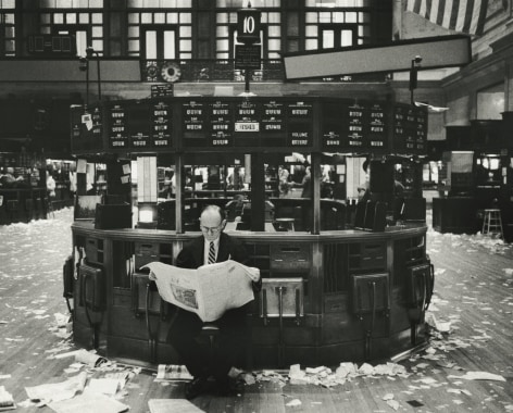 Marvin Newman - Broker Reading Newspaper in New York Stock Exchange After Closing, 1957 - Howard Greenberg Gallery