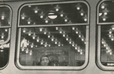 Untitled (woman in train car window), c.1950s  Gelatin silver print; printed c.1950s  8 3/8 x 12 5/8 inches