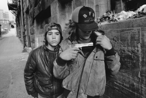 Mary Ellen Mark  &quot;Rat&quot; and Mike with a Gun, Seattle, Washington, 1983  Gelatin silver print; printed later  16 x 20 inches  From an edition of 75