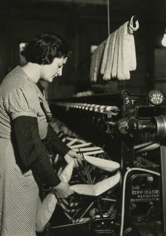 lewis hine, After drying, the skeins are taken from the rack and each skein is put on a swift of the winding machine, Paterson, New Jersey, March 18, 1937   Gelatin silver print; printed c.1937   6 5/8 x 4 5/8 inches