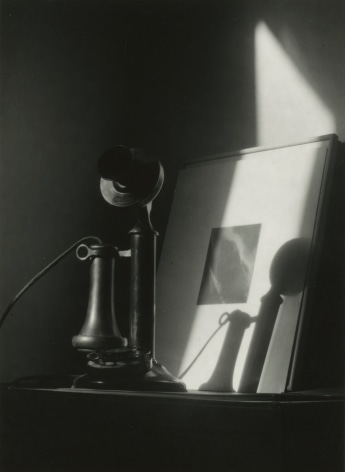 Dorothy Norman - Telephone, in front of Alfred Stieglitz &quot;Equivalent,&quot; at An American Place, New York, c. 1940 - Howard Greenberg Gallery