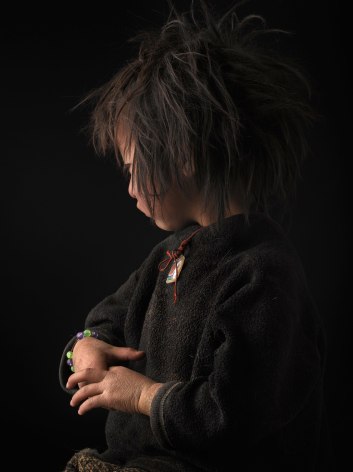David Zimmerman, One Voice, Portrait of young girl Tenzin Kalzom with unkempt hair and chapped hands, 2012, Sous Les Etoiles Gallery