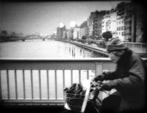 James Whitlow Delano, Mangaland, Cycling accross Sumida River Bridge in Ueno, Tokyo, Japan, 2005, Sous Les Etoiles Gallery