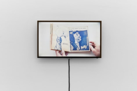 Installation view, Bizarre Silks, Private Imaginings and Narrative Facts, etc., an exhibition by Nick Mauss, view on video documentation of Ray Johnson&rsquo;s artist book Ray Gives a Party, ca. 1955, Kunsthalle Basel, 2020. Photo: Philipp H&auml;nger / Kunsthalle Basel