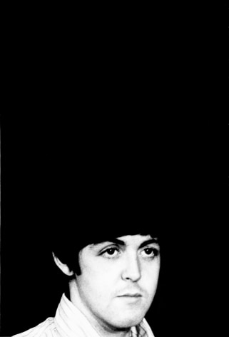 Black and white image from a Beatles press conference in 1966. Close up of Paul McCarteny