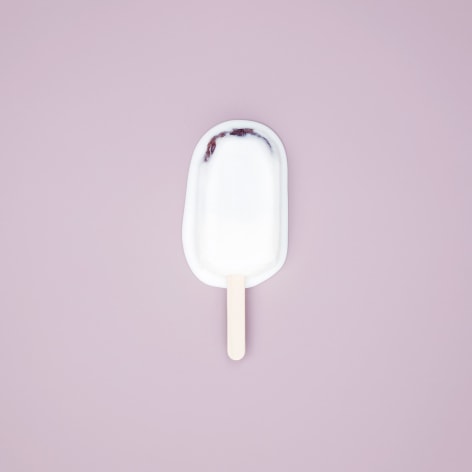Color photo of a popsicle melting on a pale purple background.