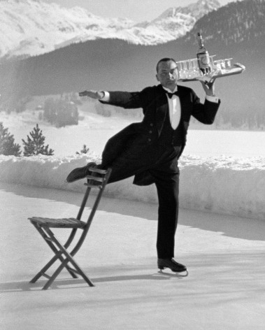 Alfred Eisenstaed Ice-skating waiter, Grand Hotel, St. Moritz,1932 Photo by Alfred Eisenstaedt. &copy;The Picture Collection Inc. All Rights Reserved.