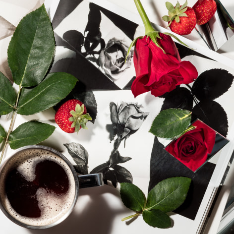 black and white photographs by Florence Henri of roses with a cup of coffee and an actual rose on top.