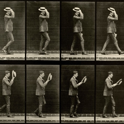 Sequence of black and white images showing the movements of a man in a suit walking and taking off his straw hat.