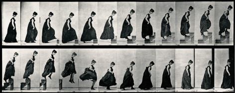 Sequential black and white photos of a woman in a long dress ascending steps and jumping off,