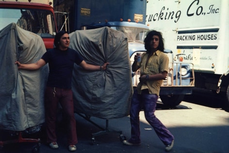 Helen Levitt, New York City, 1971 (Men with Garment racks)