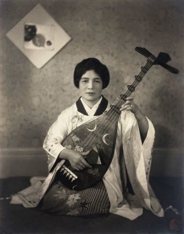 Black and white image: Woman Playing the Biwa (traditional Japanese stringed instrument)
