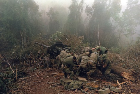 Larry Burrows Inspecting 122 MM artillery piece near Laos border,  1968