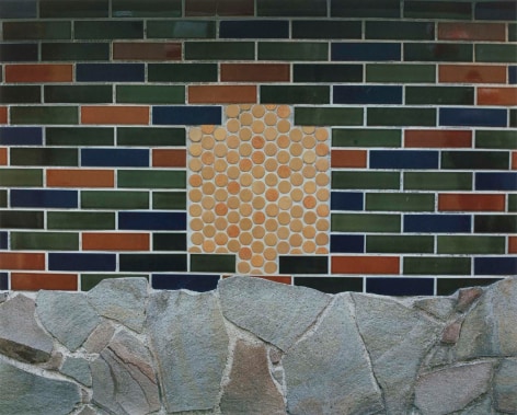 Color photo of a wall with decorative brick, tile, and rock