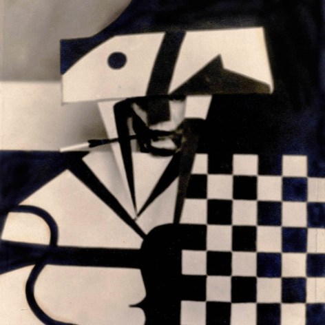Vintage black and white photo of a man in a checkered cubist stage costume