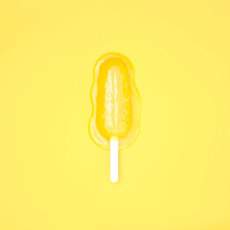 Color photo of a yellow popsicle melting on a yellow background.