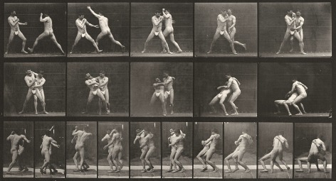Sequence of black and white photos showing movements of two men boxing.