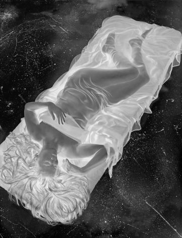 Negative image of woman, nude except for a transparent sheet, reclining on a mattress. The pocked concrete floor behind her, seen in negative, looks like a starry sky.