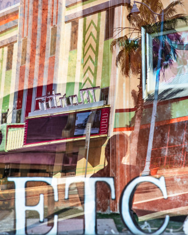 Photo of urban reflections on a window with letters that spell out &quot;ETC&quot;
