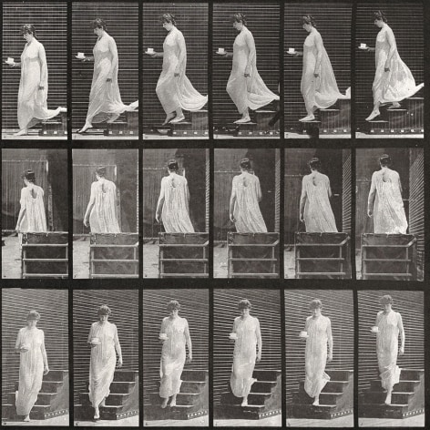 Sequence of black and white photos showing movements of woman descending stairs in a white gown, with a cup and saucer in her hand.