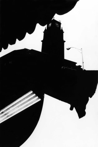 Black and white composite photo of abstracted street scenes.