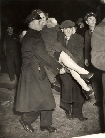 Weegee Untitled (woman carried by policeman), late 1930s