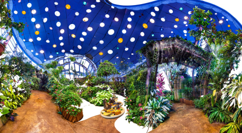 Distorted composite panoramic photo of a butterfly sanctuary. The ceiling is blue with white and orange lights, plants are throughout.