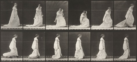 Sequence of black and white images showing movements of a woman walking in along 19th century dress, stooping and lifting train