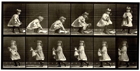 Sequence of 12 old black and white image showing the motion of a child lifting a doll and running.