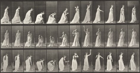 Series of black and white photographs showing he motions of a woman in 19th century dress picking uo a ball and throwing it.