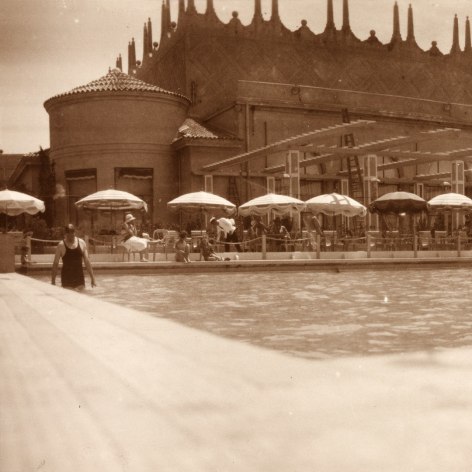Warm toned back and white phot of a pool at a resort on the French Riviera.