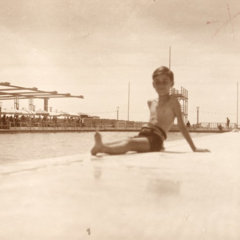 Warm toned back and white phot of a pool at a resort on the French Riviera.