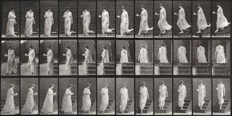 Sequential black and white photos of a woman descending stairs, turning, cup and saucer in right hand