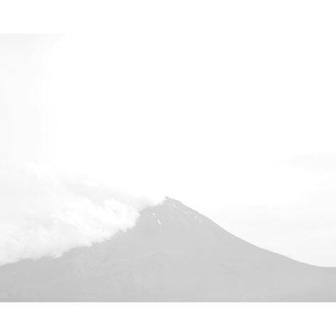 Low contrast color photo of clouds obscuring Mount Fuji in Japan.